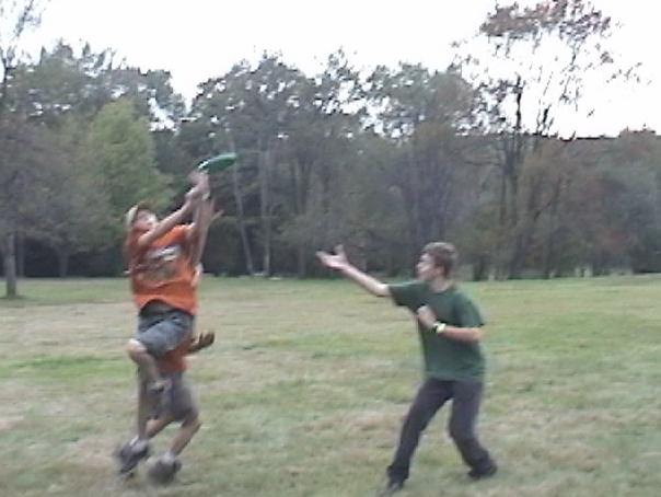 Scouts playing ultimate frisbee.