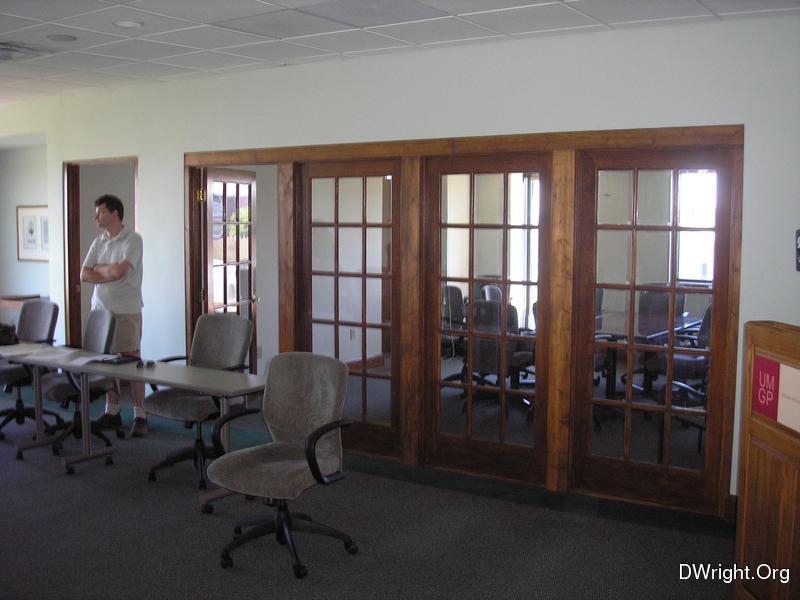 Large meeting room looking into smaller room.